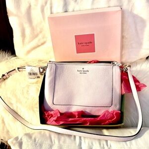 Kate Spade 
Length: 1.4"
Height: 6.56"
Width:10.12"
Materials
Pebbled Leather